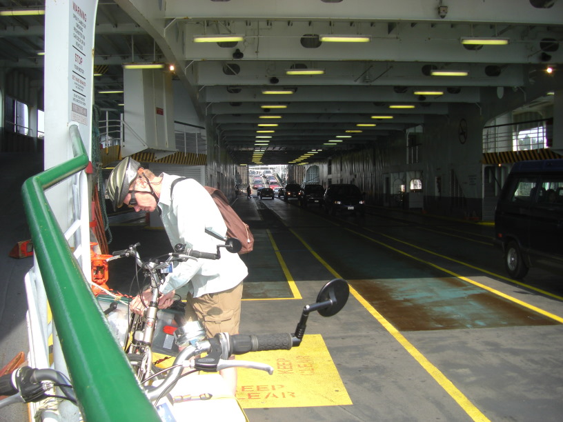 lashing down our bikes with a view of the interior of the lower car deck