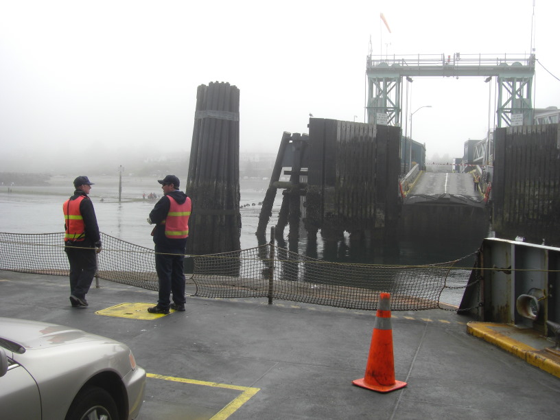 a foggy landing in Edmonds.  See the people on the mud flats behind the ferry boatmen?